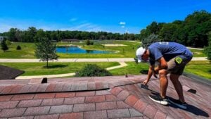 After roof inspection next steps showing homeowner reviewing roof report and inspection findings