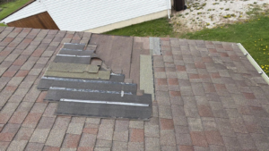 leaking residential roof during storm showing temporary roof repair limitations in mount vernon