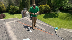 storm season roof inspection checking shingles and flashing before severe weather