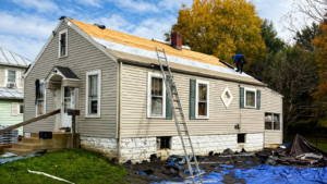 Roof decking repair Ohio showing exposed roof sheathing before new shingles are installed